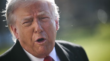 Donald Trump speaks while standing outside the White House