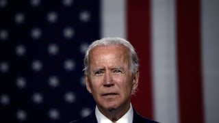 Biden speaks in front of American flag