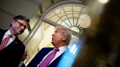 Donald Trump, accompanied by Speaker of the House Mike Johnson, speaks to members of the media.