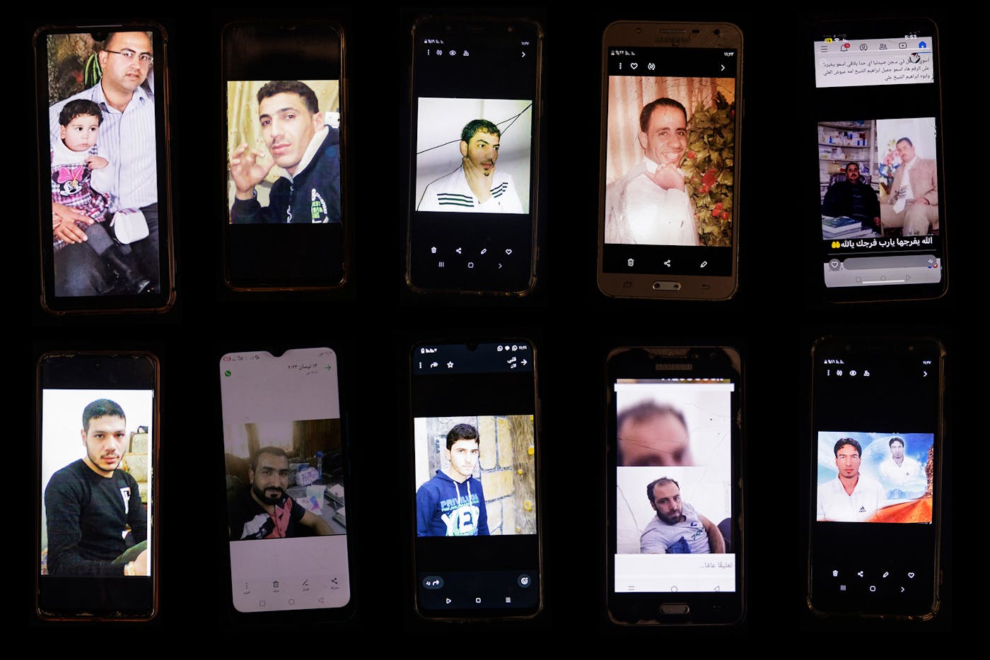 View of different cell phones belonging to the relatives of missing men believed to be held in Sednaya Prison by the Assad regime. 