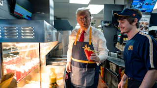 Donald Trump works behind the counter during a campaign event at McDonald's restaurant.
