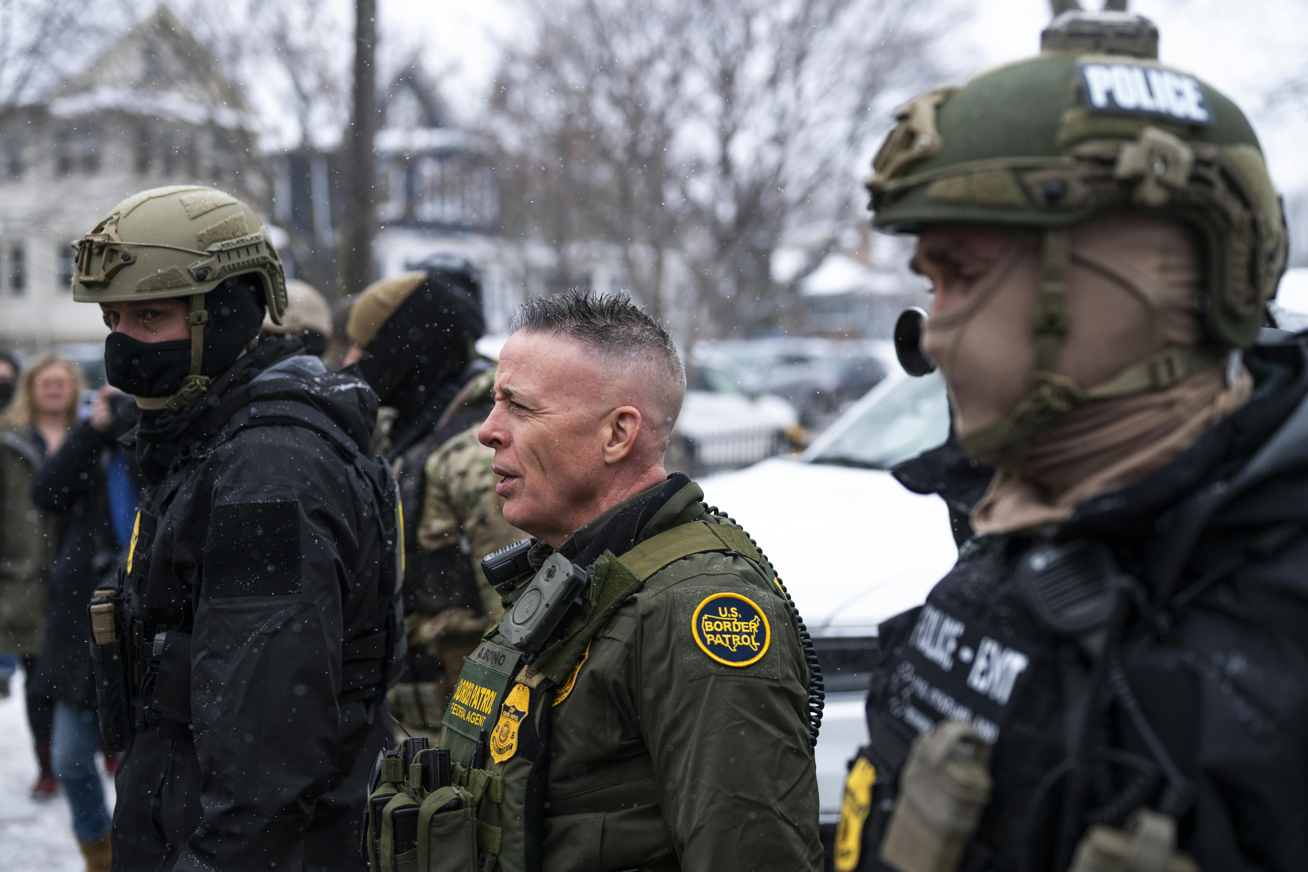 CBP Chief Gregory Bovino stands with masked agents in Minneapolis, Minnesota