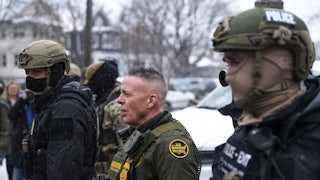 CBP Chief Gregory Bovino stands with masked agents in Minneapolis, Minnesota