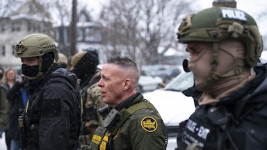 CBP Chief Gregory Bovino stands with masked agents in Minneapolis, Minnesota