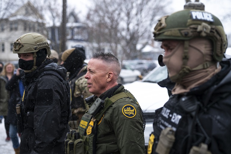 CBP Chief Gregory Bovino stands with masked agents in Minneapolis, Minnesota