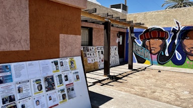 Bulletin boards with notices about missing Indigenous people, at Drumbeat Indian Arts in Phoenix