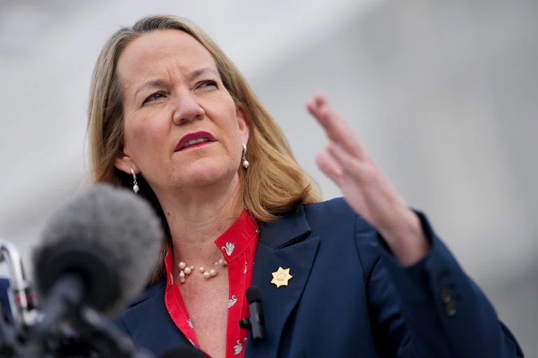 Kris Mayes, Arizona’s attorney general, speaks outside the Supreme Court.