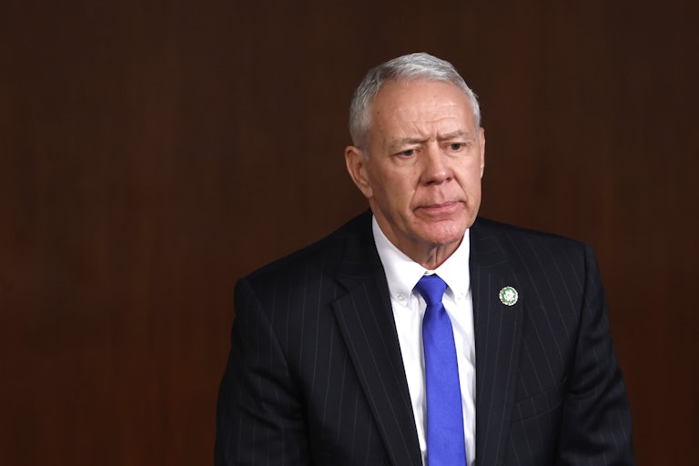 Ken Buck looks concerned or angry