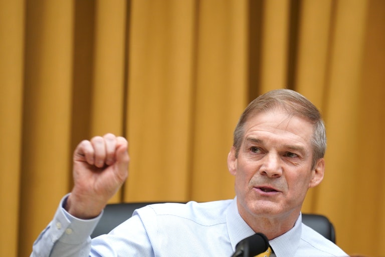 Representative Jim Jordan speaks and makes a hand gesture in a congressional hearing