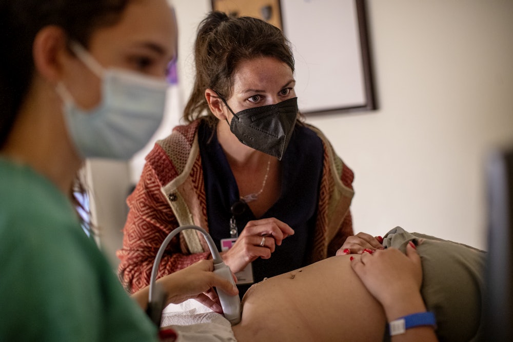 A family physician and her resident perform an ultrasound on a 25-year-old woman the day before the Supreme Court overturned Roe v. Wade at the Center for Reproductive Health clinic in Albuquerque, New Mexico.
