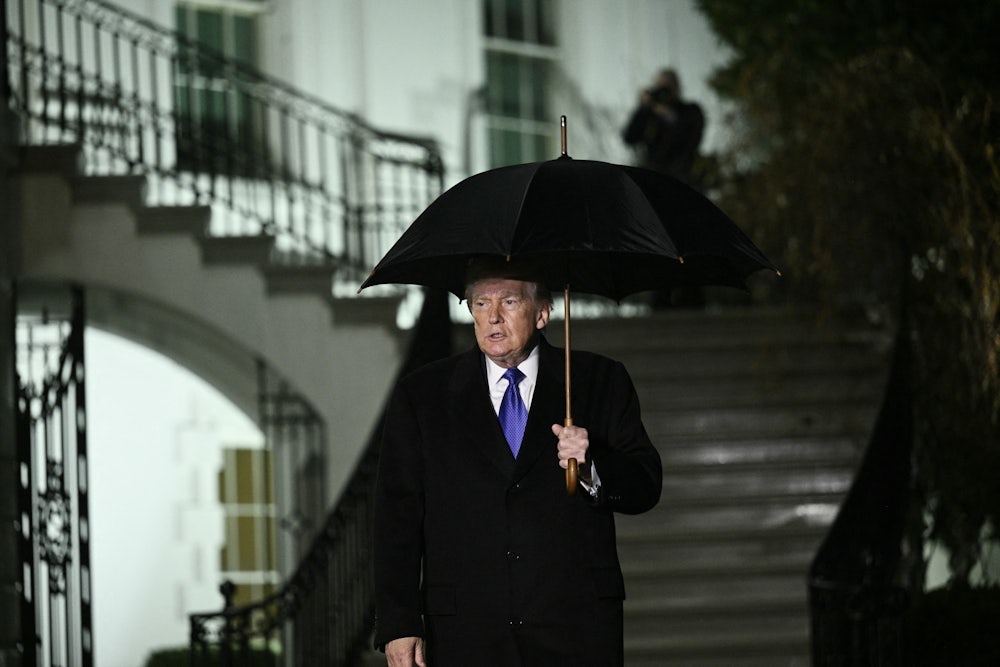 Donald Trump walks to speak to reporters as he departs from the South Lawn of the White House.