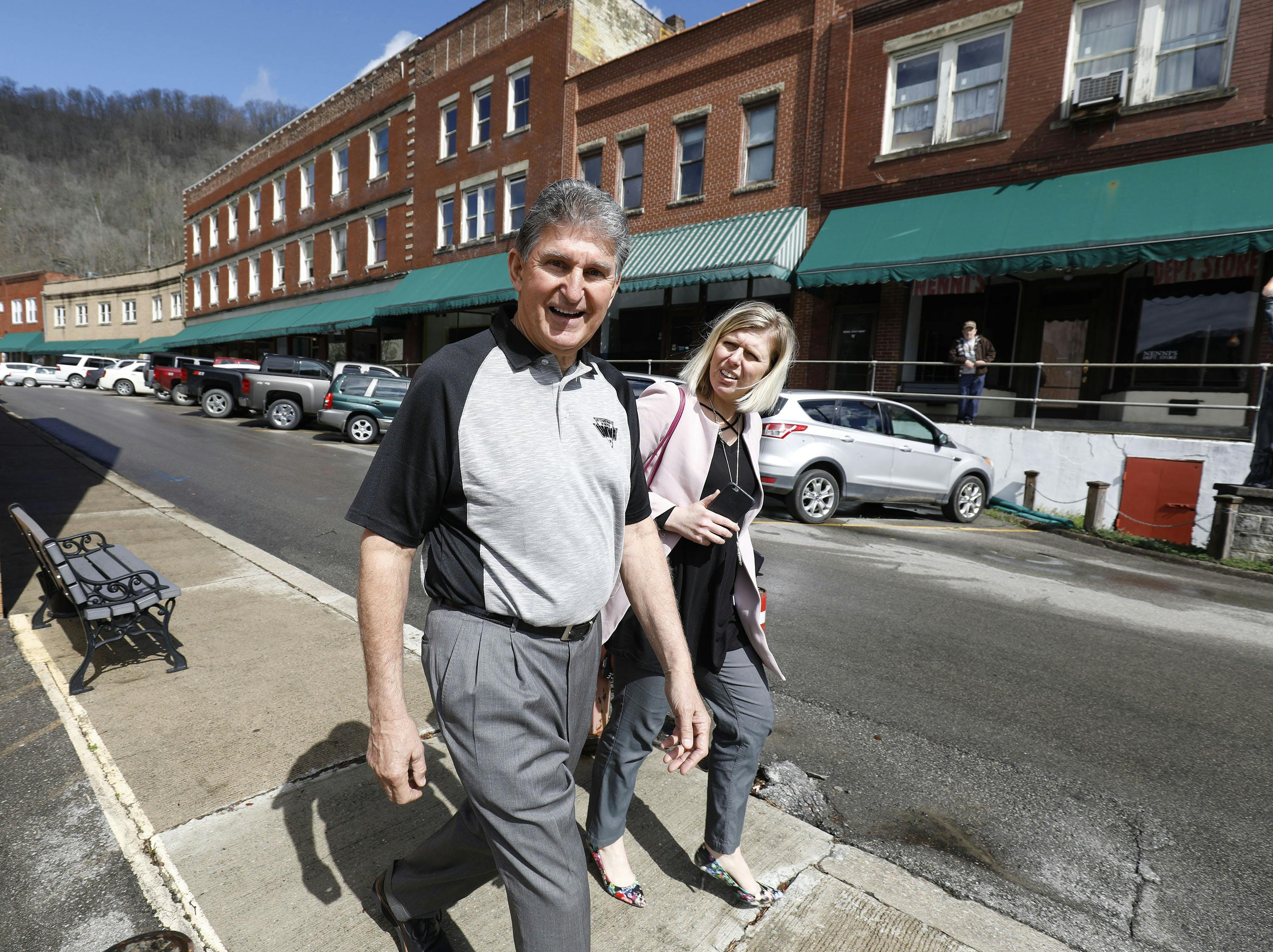 Manchin walks to a meeting with coal miners