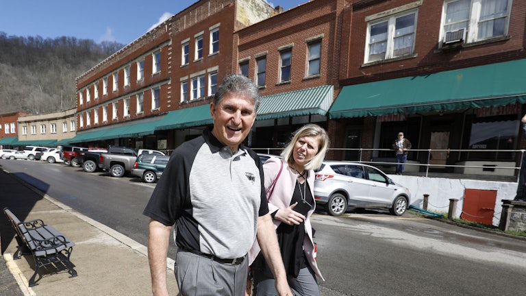 Manchin walks to a meeting with coal miners