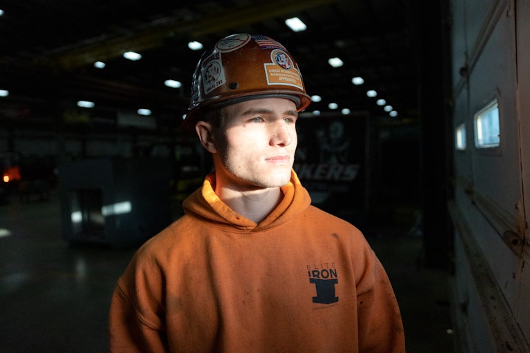 A student stands for a portrait at Ironworkers Local 29 during a steelwork apprenticeship in Dayton, Ohio.