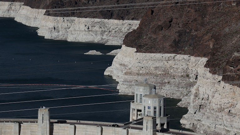 Low water levels are seen at Lake Mead, indicated by bleached rock where water once was.