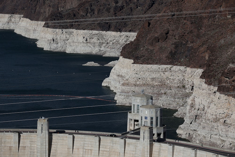 Low water levels are seen at Lake Mead, indicated by bleached rock where water once was.