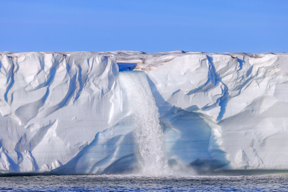 A waterfall at the Bråsvellbreen glacier in the Barents Sea, through which an important ocean current, the Amoc, passes.