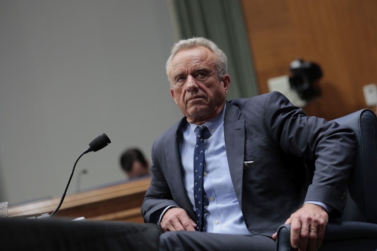 Robert F. Kenedy Jr. sits in a chair during a Senate hearing