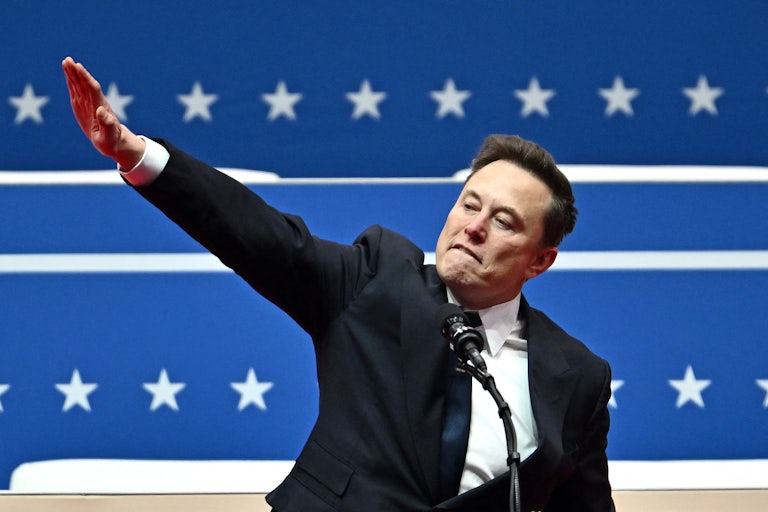 Elon Musk appears to do the Nazi salute at a lectern during Trump’s inaugural parade