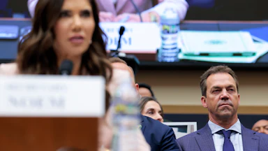 Bryon Noem looks on as Kristi Noem testifies in Congress.