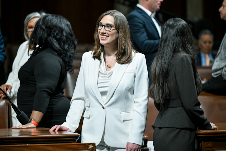 Representative Sarah McBride smiles while standing in Congress ahead of Donald Trump's State of the Union