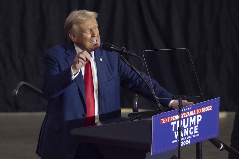 Donald Trump gestures while speaking at a campaign event