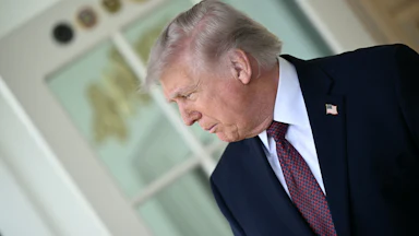 Donald Trump speaks to the press outside the Oval Office.