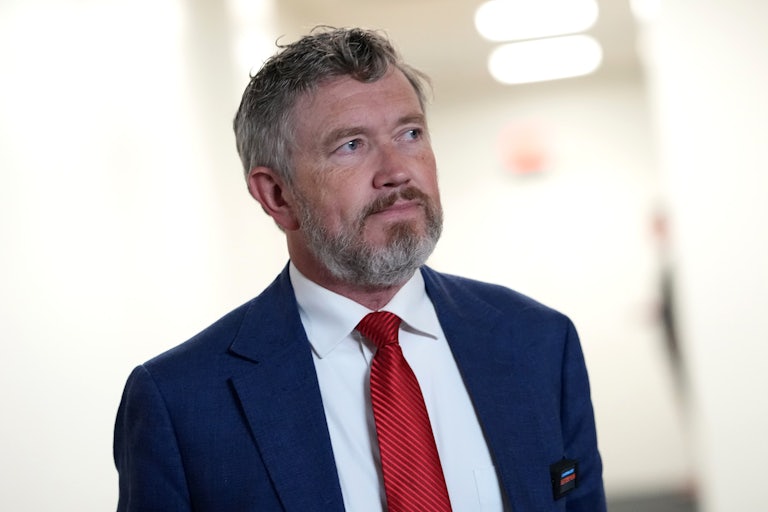 Representative Thomas Massie walks in the Capitol