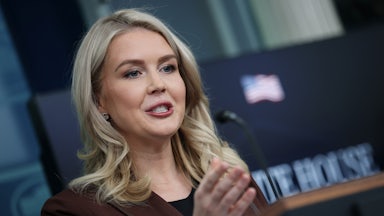 White House press secretary Karoline Leavitt gestures while speaking at a podium