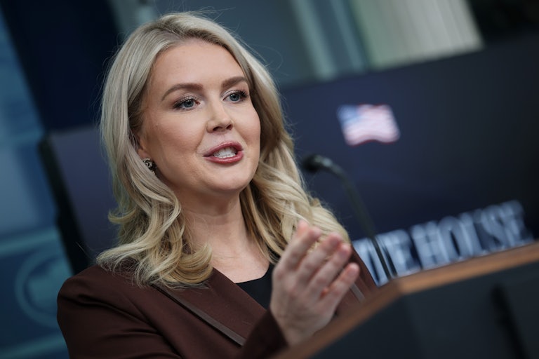 White House press secretary Karoline Leavitt gestures while speaking at a podium