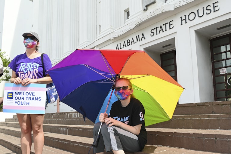 Christa White (L) and her daughter protest anti-LGBTQ legislation outside the Alabama State House