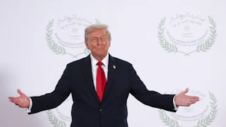 Donald Trump holds out his arms