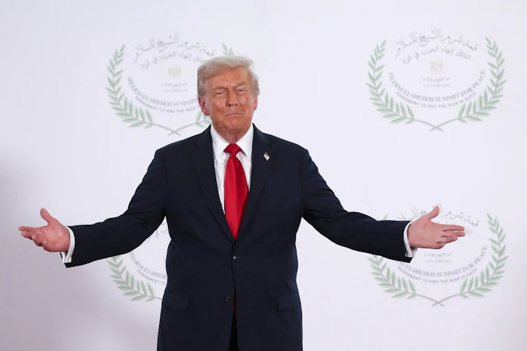 Donald Trump holds out his arms