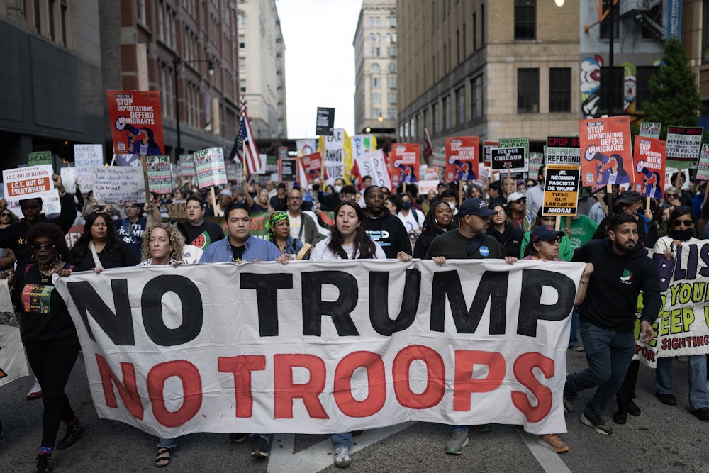 Demonstrators march through downtown Chicagi during a protest against President Donald Trump’s immigration policies on September 06, 2025.