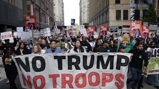 Demonstrators march through downtown Chicagi during a protest against President Donald Trump’s immigration policies on September 06, 2025.