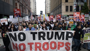 Demonstrators march through downtown Chicagi during a protest against President Donald Trump’s immigration policies on September 06, 2025.