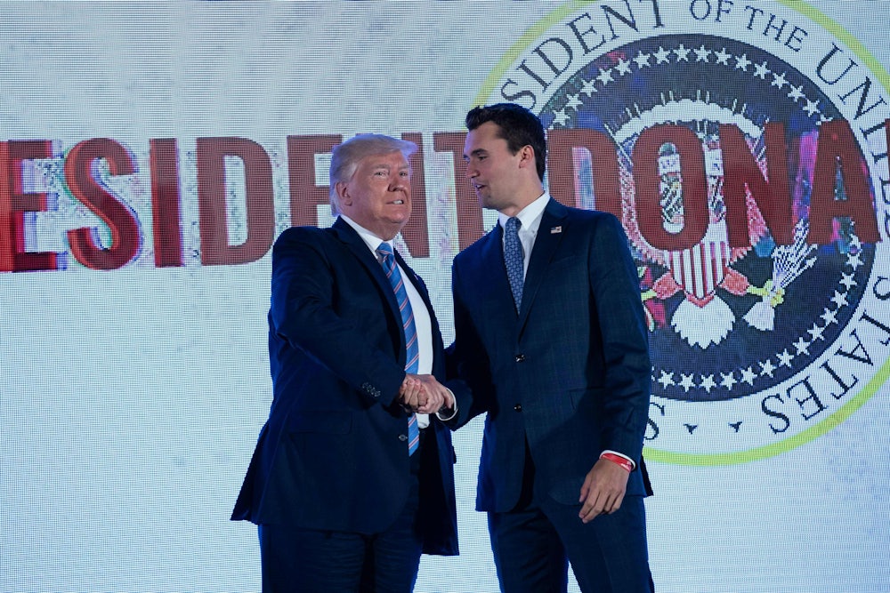 Donald Trump shakes hands with Charlie Kirk before addressing the Turning Point USAs Teen Student Action Summit.