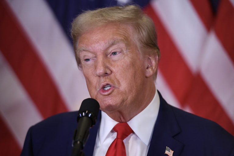 Donald Trump speaks into a microphone