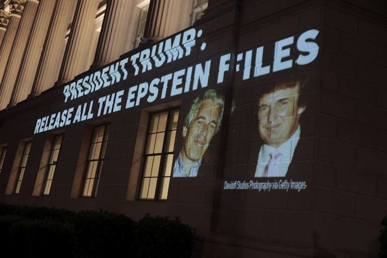 A photo of Donald Trump and Jeffrey Epstein and the phrase "President Trump: release all the Epstein files" are projected onto the U.S. Chamber of Commerce building in Washington, D.C.