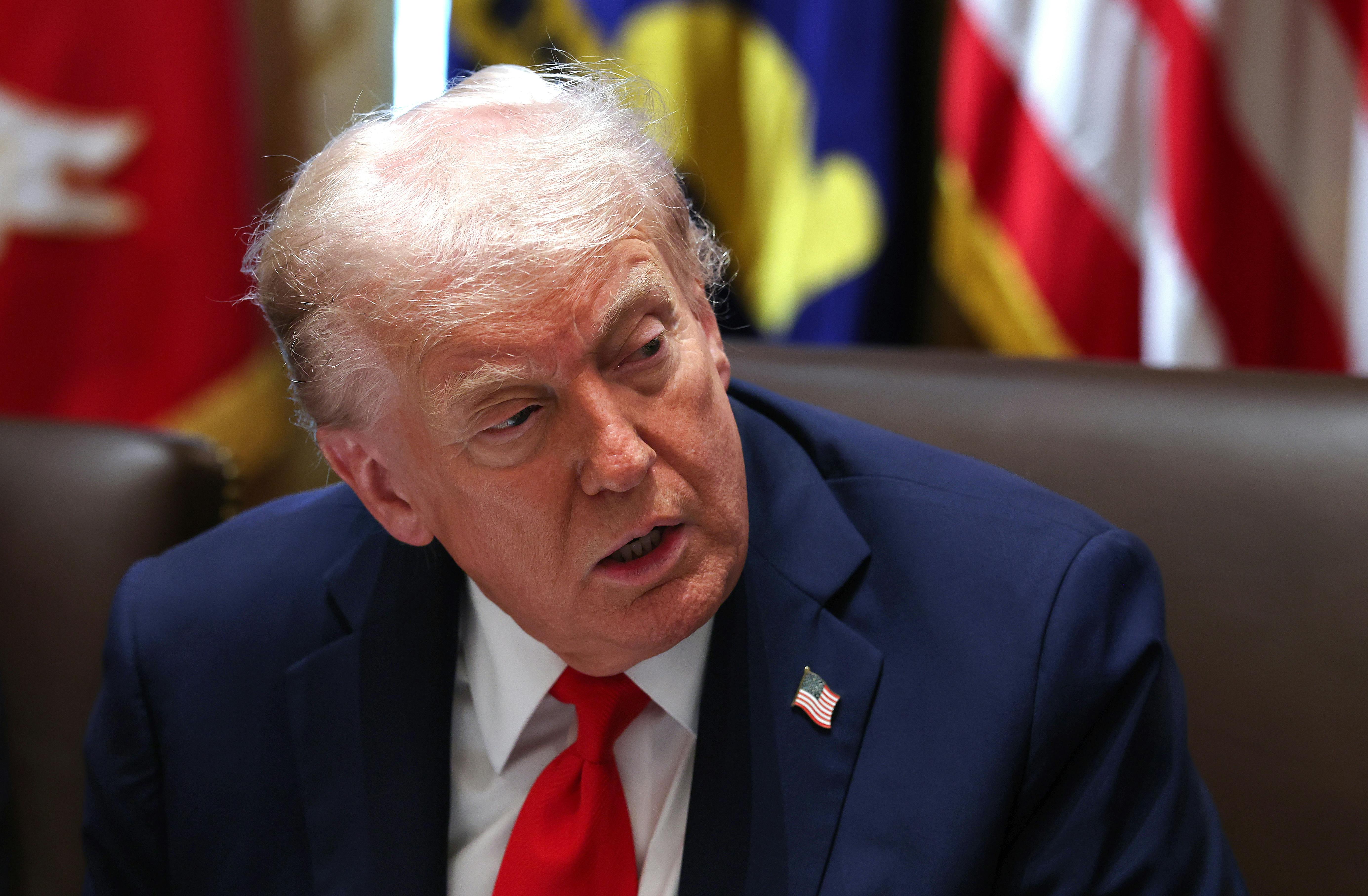 Donald Trump leans over and you can see the top of his head thinning.