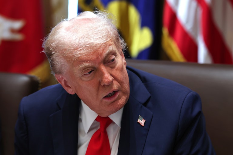 Donald Trump leans over and you can see the top of his head thinning.