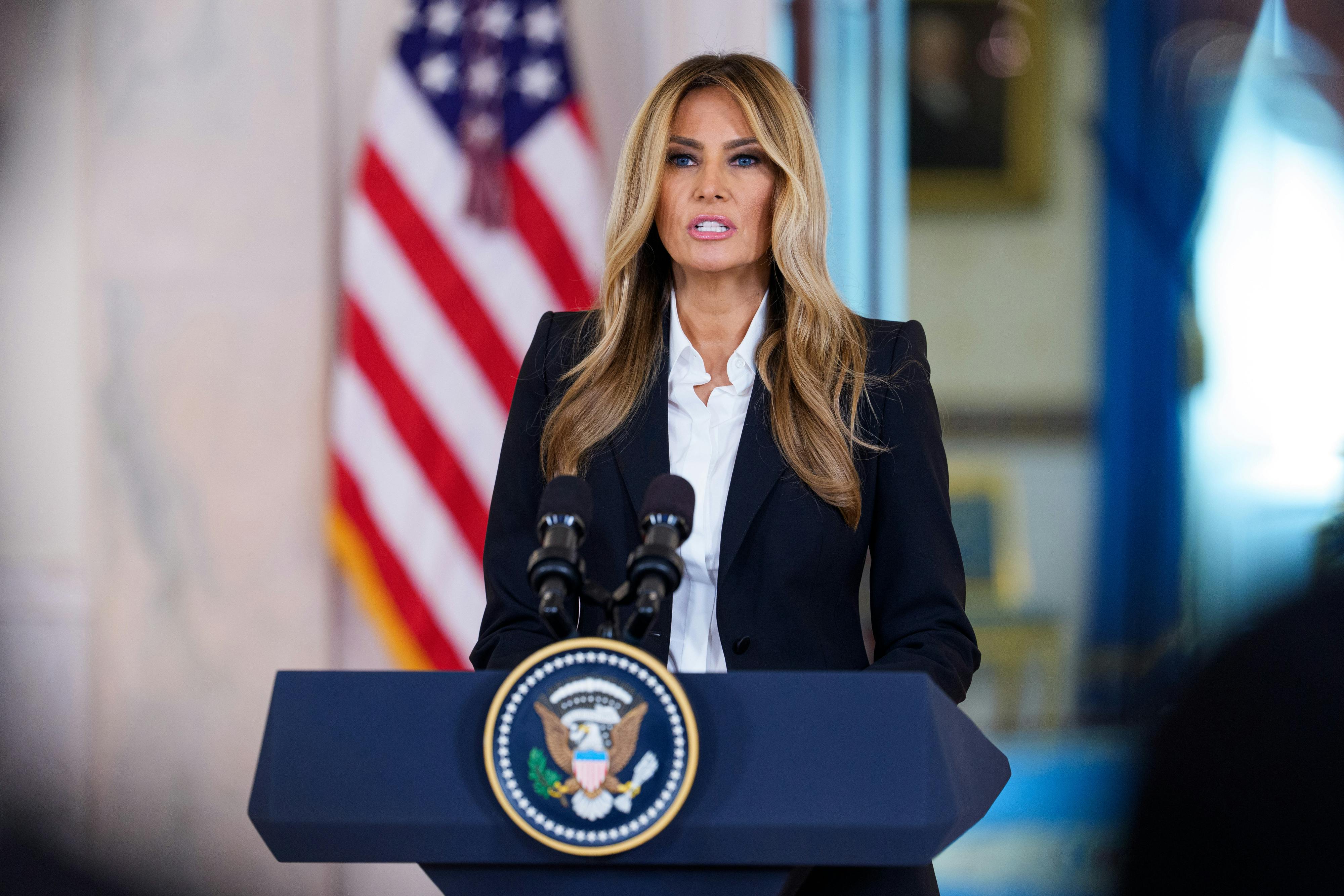 Melania Trump speaks at a podium