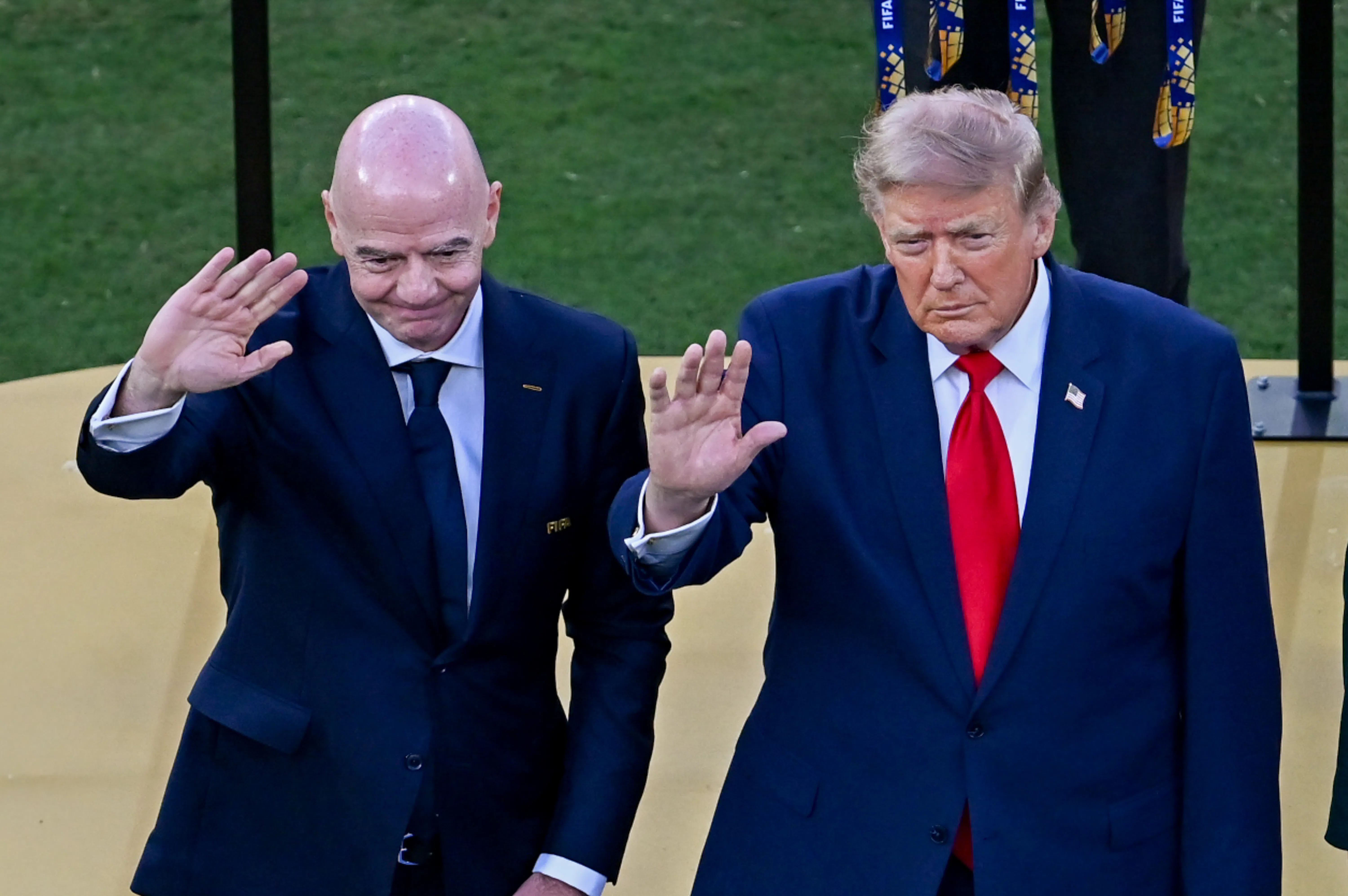FIFA President Gianni Infantino and U.S. President Donald Trump wave after the World Cup final