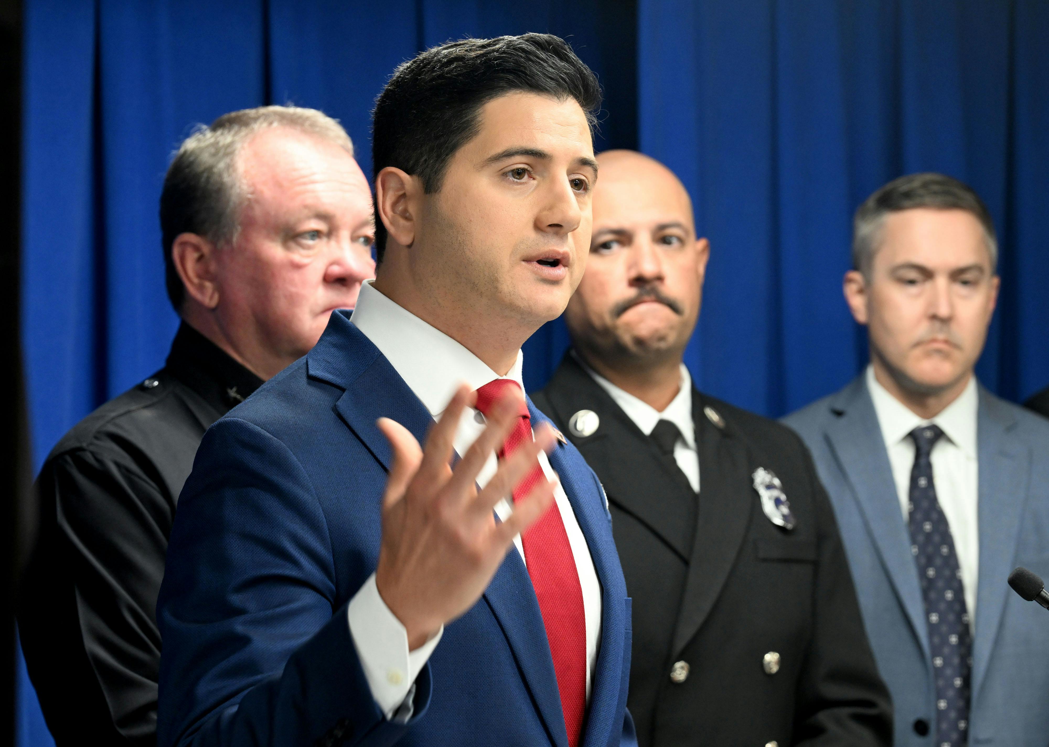 Acting U.S. Attorney for the Central District of California Bill Essayli gestures with one hand while speaking during a press conference
