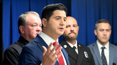 Acting U.S. Attorney for the Central District of California Bill Essayli gestures with one hand while speaking during a press conference