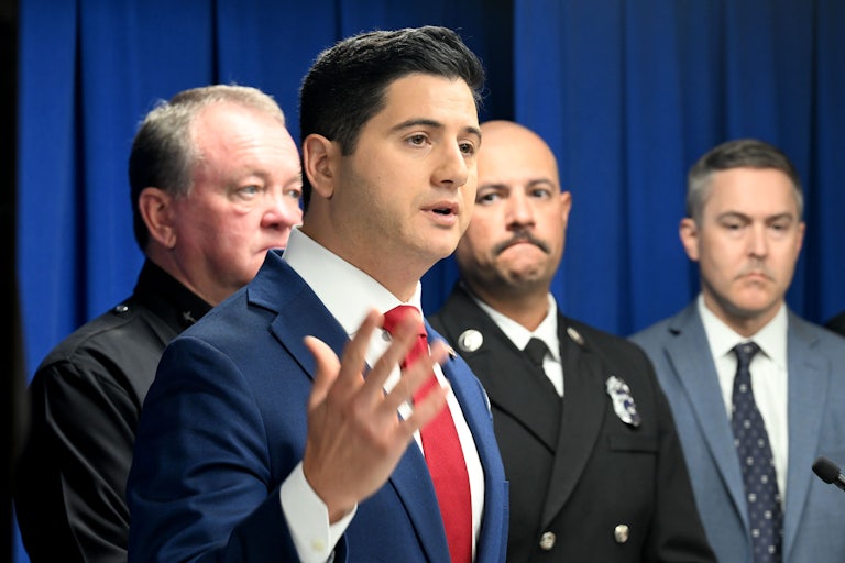 Acting U.S. Attorney for the Central District of California Bill Essayli gestures with one hand while speaking during a press conference