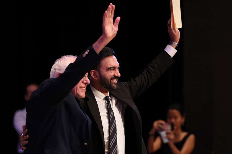 Senator Bernie Sanders and New York mayoral candidate Zohran Mamdani walk on stage during the Fighting Oligarchy town hall on September 6, 2025 in New York City.