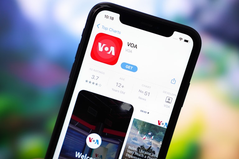 A phone screen shows the App Store page for the Voice of America app