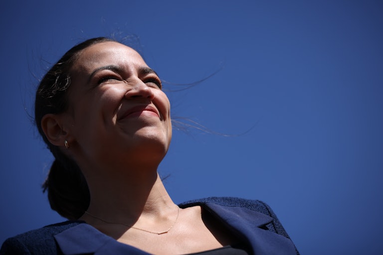 Alexandria Ocasio-Cortez laughs