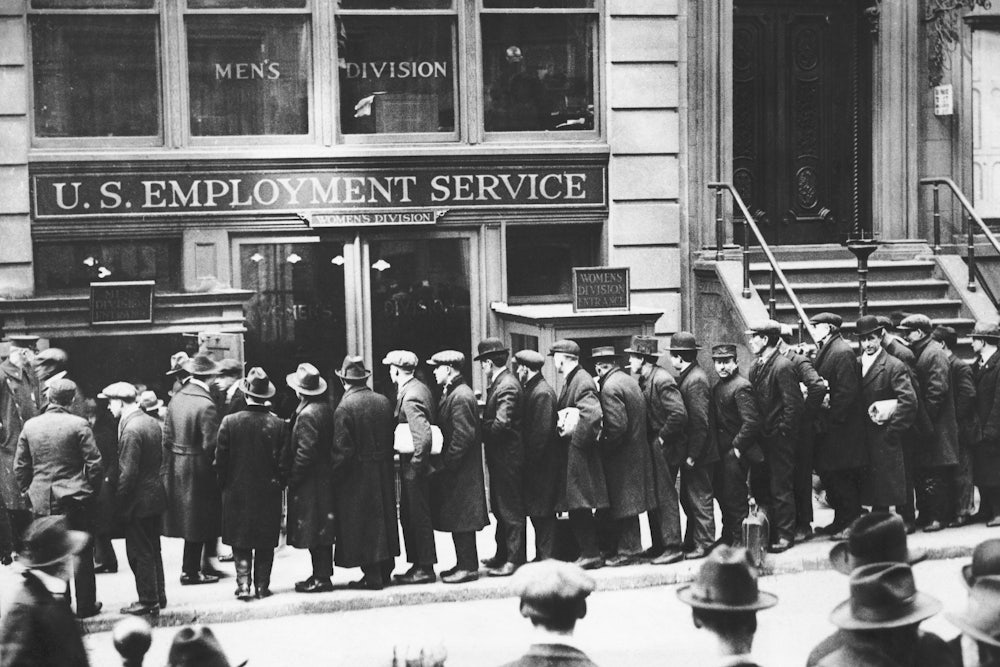 Men are waiting in line, in front of the Office of the U. S. employment Bureau in New York City.